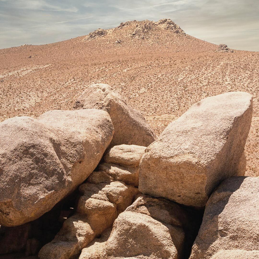 An image of heavy rocks in a desert. They represent the listless and aching feeling some people experience in their legs after chemotherapy